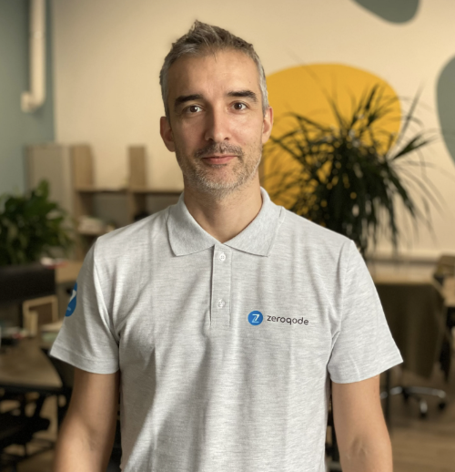 Portrait of Oleg Sirbu, International HR Director, in a modern office